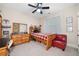 Bedroom featuring carpet floors, a window, ceiling fan and a bed at 2121 Whitekirk Nw St, Kennesaw, GA 30152