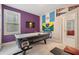 The bonus room offers an air hockey table, TV, flags and pennants, and neutral carpet at 2121 Whitekirk Nw St, Kennesaw, GA 30152