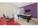 Bright bonus room features an air hockey table, TV, and cozy seating area at 2121 Whitekirk Nw St, Kennesaw, GA 30152