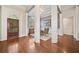 Grand foyer with hardwood floors, decorative columns, and arched doorway offering a luxurious entrance at 2121 Whitekirk Nw St, Kennesaw, GA 30152
