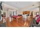 Entertaining space offering a game room with a pool table that opens to the kitchen with barstool seating at 2121 Whitekirk Nw St, Kennesaw, GA 30152