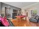 Spacious living room featuring a fireplace, large TV, and a pool table with leather seating at 2121 Whitekirk Nw St, Kennesaw, GA 30152
