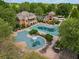 Resort-style pool with a slide, sun deck, and chairs, perfect for relaxation at 2121 Whitekirk Nw St, Kennesaw, GA 30152