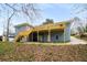 Exterior backyard view of a home with a large deck and covered patio area at 3069 Thrasher Cir, Decatur, GA 30032