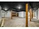 Spacious unfinished basement with exposed ceiling, concrete floors, and wooden support beams at 3069 Thrasher Cir, Decatur, GA 30032