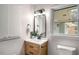 Bathroom features a modern vanity, decorative mirror and fixtures with a bright window at 3069 Thrasher Cir, Decatur, GA 30032