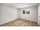 Neutral bedroom features wood floors, white trim, and a window offering natural light at 3069 Thrasher Cir, Decatur, GA 30032