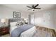 Bedroom with hardwood floors, decorative pillows, modern fan, and bedside tables at 3069 Thrasher Cir, Decatur, GA 30032