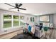 Comfortable living room featuring hardwood floors, large windows, and a modern fireplace at 3069 Thrasher Cir, Decatur, GA 30032