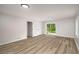 Spacious living room with hardwood floors and sliding doors to the outside at 3069 Thrasher Cir, Decatur, GA 30032