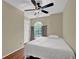 Small bedroom with wood floors, a ceiling fan, and a window at 7037 Waters Edge Dr, Stone Mountain, GA 30087