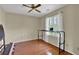Bedroom featuring wood floors, ceiling fan, natural light at 7037 Waters Edge Dr, Stone Mountain, GA 30087