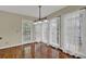 Bright breakfast nook featuring hardwood floors, large windows, and door to outdoor deck at 7037 Waters Edge Dr, Stone Mountain, GA 30087