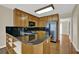 Kitchen with black countertops, stainless steel refrigerator, and abundant cabinet storage at 7037 Waters Edge Dr, Stone Mountain, GA 30087