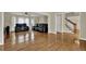 Expansive living room with hardwood floors, staircase, and an open layout perfect for entertaining at 7037 Waters Edge Dr, Stone Mountain, GA 30087