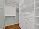 A spacious walk-in closet with custom shelving and drawers to maximize storage and organization at 7037 Waters Edge Dr, Stone Mountain, GA 30087