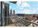 Stunning balcony view showcases the city skyline and bright blue sky at 855 Peachtree Ne St # 2403, Atlanta, GA 30308