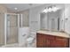 Bathroom with glass shower, granite countertop vanity, and neutral tiling at 855 Peachtree Ne St # 2403, Atlanta, GA 30308