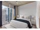 Inviting bedroom with a large window, and light-colored walls at 855 Peachtree Ne St # 2403, Atlanta, GA 30308