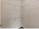 Bright walk-in closet featuring white wire shelving at 855 Peachtree Ne St # 2403, Atlanta, GA 30308