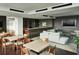 Modern clubhouse featuring kitchen, lounge area, and dining tables for residents at 855 Peachtree Ne St # 2403, Atlanta, GA 30308