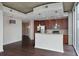 Modern kitchen featuring stainless steel appliances, dark cabinets, and concrete ceiling at 855 Peachtree Ne St # 2403, Atlanta, GA 30308