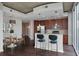Modern kitchen with stainless steel appliances, dark cabinets, and counter seating at 855 Peachtree Ne St # 2403, Atlanta, GA 30308
