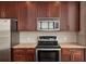 Close up on the modern kitchen featuring stainless steel appliances and granite countertops at 855 Peachtree Ne St # 2403, Atlanta, GA 30308