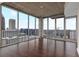 Bright living room with a city view and hardwood floors at 855 Peachtree Ne St # 2403, Atlanta, GA 30308
