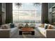 Bright living room featuring floor-to-ceiling windows with scenic views and modern furnishings at 855 Peachtree Ne St # 2403, Atlanta, GA 30308