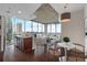 Bright, open living space with hardwood floors, city views, and modern kitchen island at 855 Peachtree Ne St # 2403, Atlanta, GA 30308