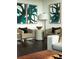 Stylish living room featuring modern art, comfortable seating, and dark wood floors at 855 Peachtree Ne St # 2403, Atlanta, GA 30308