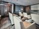 Dark and intimate movie theater room with comfortable seating and a large screen at 855 Peachtree Ne St # 2403, Atlanta, GA 30308