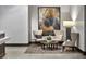 Elegant sitting area with stylish chairs, modern lighting, and a decorative rug at 855 Peachtree Ne St # 2403, Atlanta, GA 30308