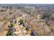 Beautiful aerial view of a residential neighborhood surrounded by lush trees and Kennesaw Mountain at 3967 Bellingrath Main Nw, Kennesaw, GA 30144