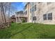 Landscaped backyard featuring a lawn and a wooden fence at 3967 Bellingrath Main Nw, Kennesaw, GA 30144