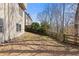 Spacious backyard with mature trees and a wood fence at 3967 Bellingrath Main Nw, Kennesaw, GA 30144