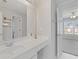 Bright bathroom with white vanity, large mirror, and entry to ensuite bedroom at 3967 Bellingrath Main Nw, Kennesaw, GA 30144