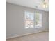 This bedroom boasts a ceiling fan and a large window that brings in natural light at 3967 Bellingrath Main Nw, Kennesaw, GA 30144