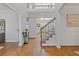 Welcoming foyer with hardwood floors and a grand staircase creates a lasting impression at 3967 Bellingrath Main Nw, Kennesaw, GA 30144