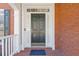 Elegant front door with decorative trim provides a warm entry at 3967 Bellingrath Main Nw, Kennesaw, GA 30144