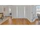 Bright living room with a front door features gleaming hardwood floors and abundant natural light at 3967 Bellingrath Main Nw, Kennesaw, GA 30144