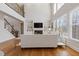 Bright, two-story living room with a fireplace, built-in shelving, and lots of natural light at 3967 Bellingrath Main Nw, Kennesaw, GA 30144