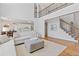 Open floor plan showing the living room with hardwood floors and a view to the adjacent kitchen at 3967 Bellingrath Main Nw, Kennesaw, GA 30144