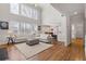 Spacious living room with soaring ceilings, hardwood floors, large windows and an open concept at 3967 Bellingrath Main Nw, Kennesaw, GA 30144