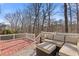 Relax on this backyard patio with comfortable outdoor seating and beautiful wooded view at 3967 Bellingrath Main Nw, Kennesaw, GA 30144