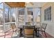 Relaxing screened porch with a dining table, chairs and view of the backyard at 3967 Bellingrath Main Nw, Kennesaw, GA 30144