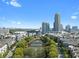 Beautiful aerial view of community, lake, and skyline at 400 17Th Nw St # 2218, Atlanta, GA 30363