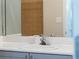 Close-up of a bathroom sink with modern faucet and stylish light-blue cabinets at 400 17Th Nw St # 2218, Atlanta, GA 30363
