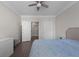 Bright bedroom features hardwood floors, ceiling fan, and ensuite bath at 400 17Th Nw St # 2218, Atlanta, GA 30363